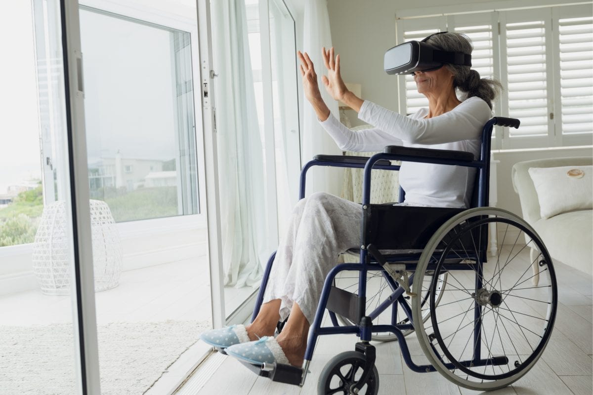 aged lady wearing the vr headset to keep her company 