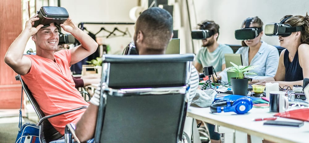 young people using virtual reality headsets in creative office