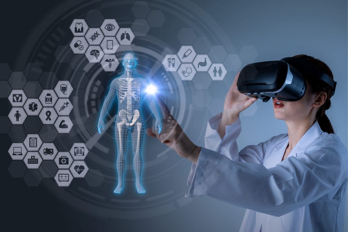Medical student using VR to experience real time simulation of human body